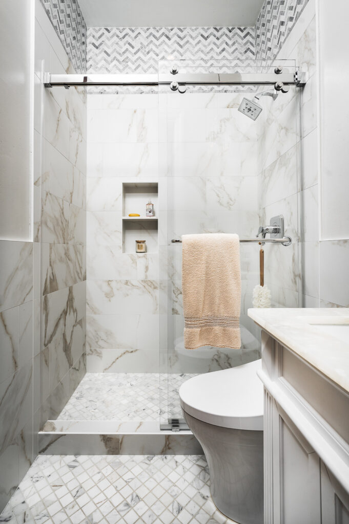 Custom marble tile shower remodel with built-in niche in Vancouver WA