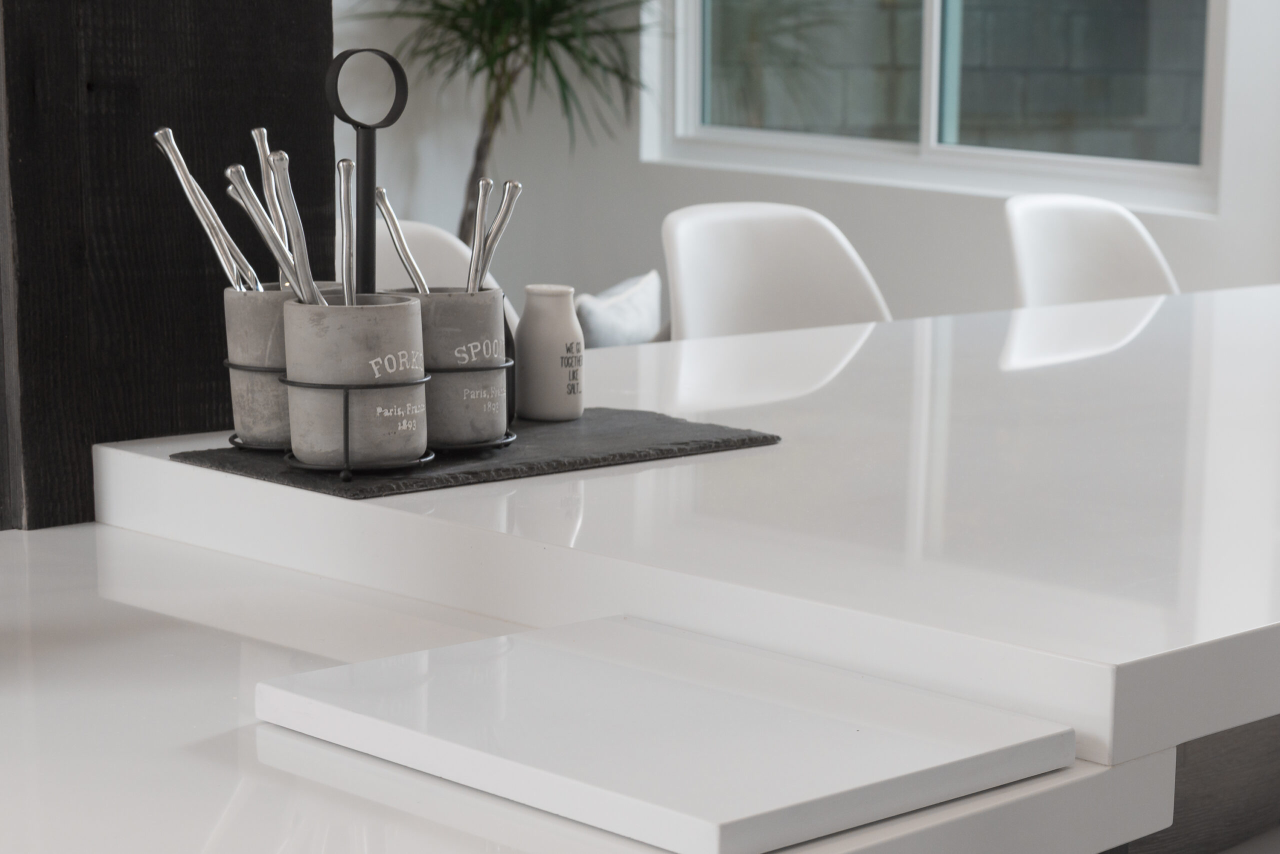 Custom built-in cabinetry with white shelving and decorative tile accents
